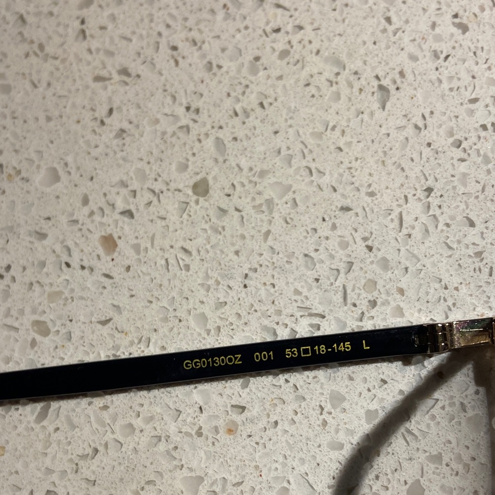 Gucci GG0130OZ 001 Elegant Black and Gold Eyewear - Picture 2 of 9